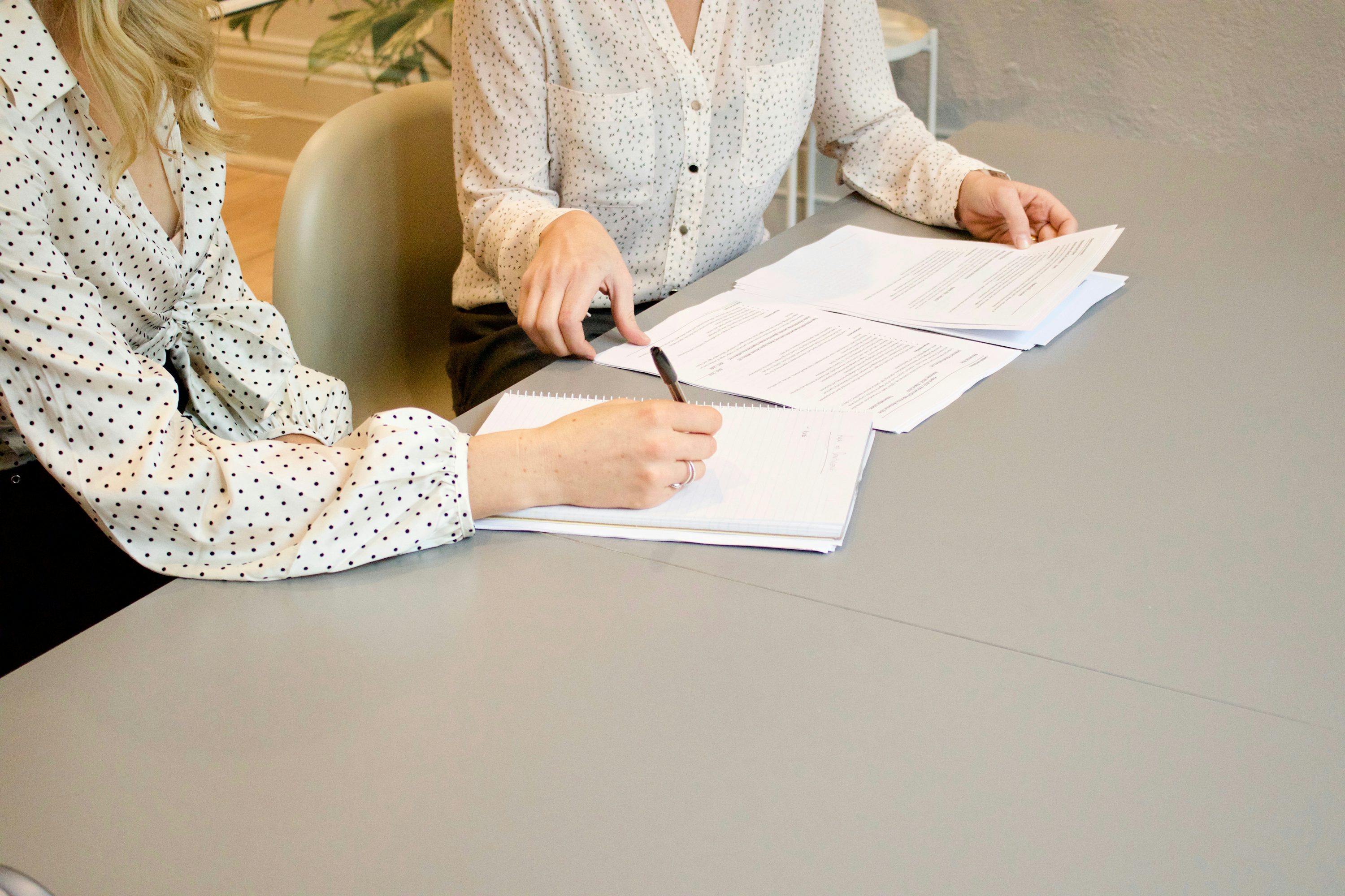 A small-business owner discussing a commercial lease with a lawyer