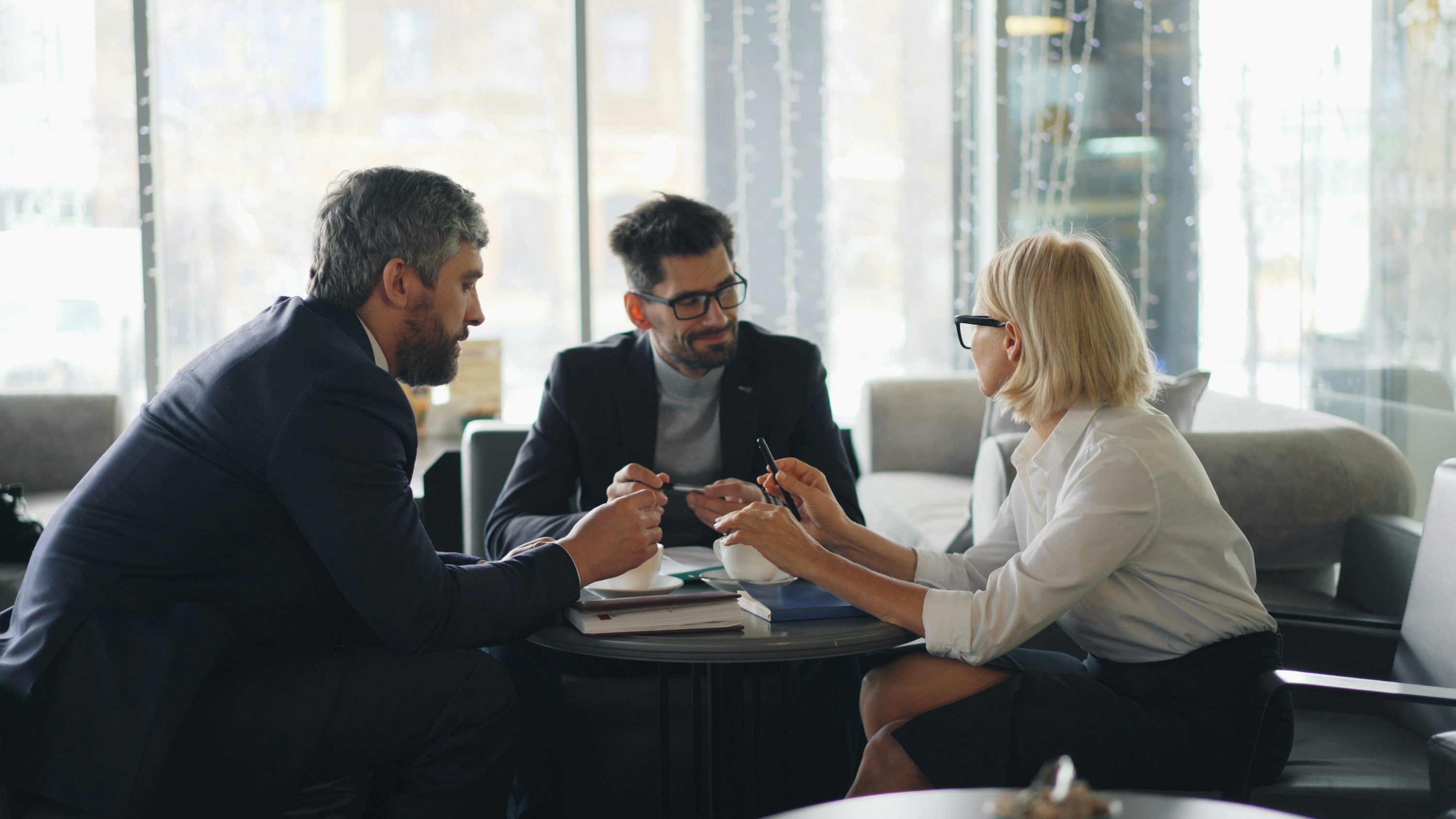 A business founder reviewing a contract with a lawyer