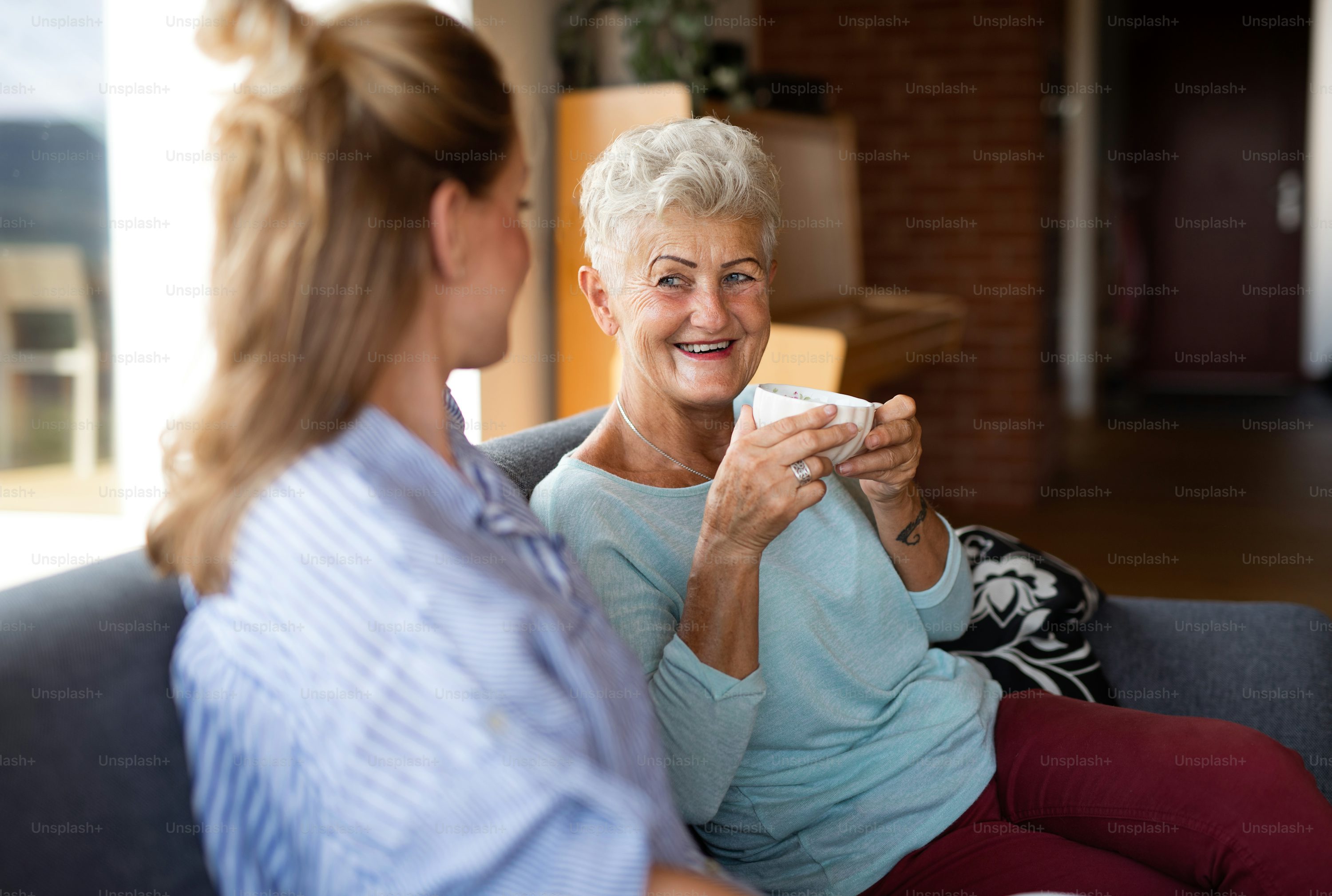 An adult daughter and father discussing legacy planning with a lawyer